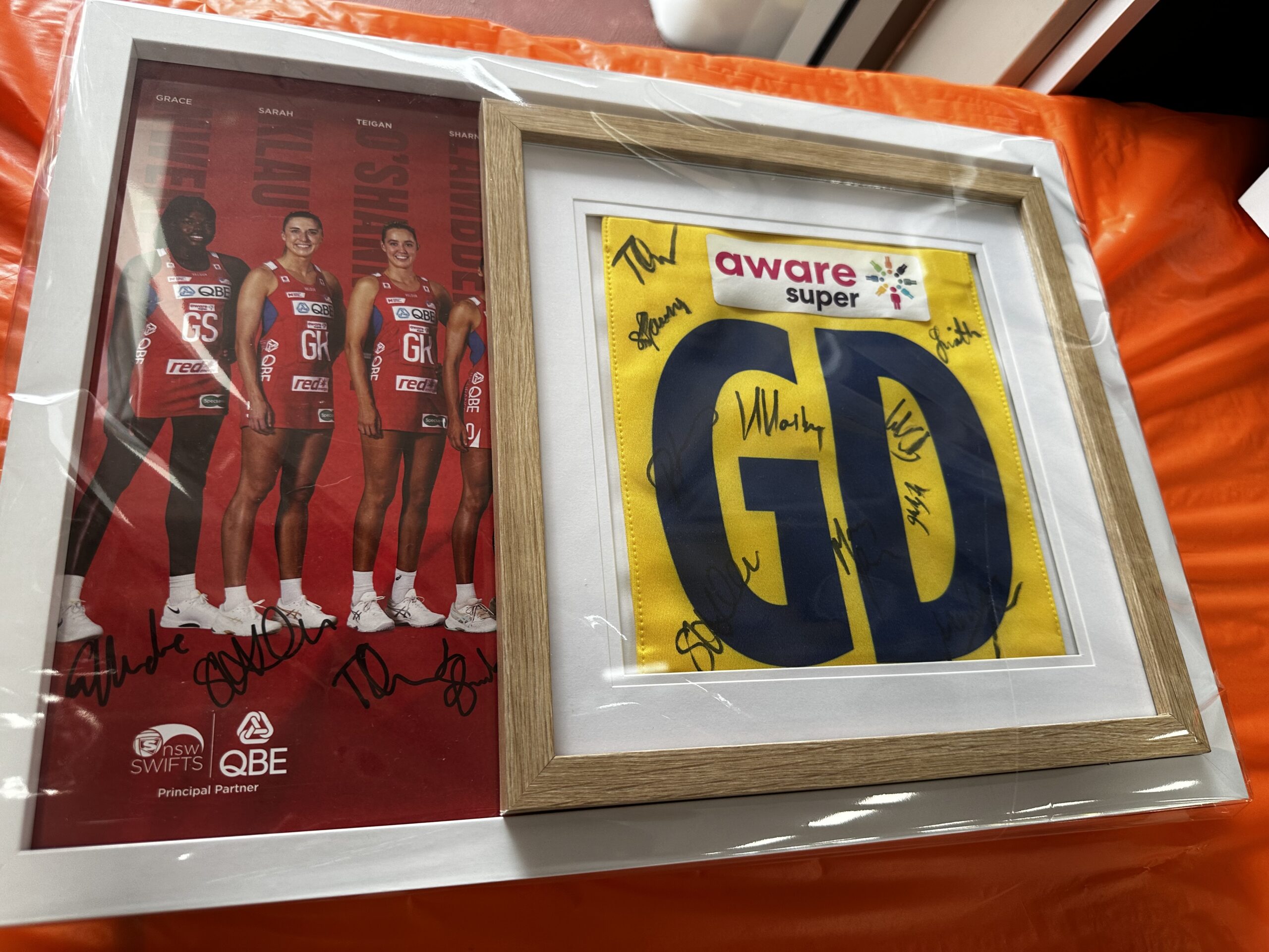 Signed Swifts Posters and Signed Netball Bib Value $200